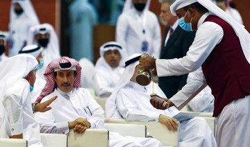 Red carpet, prayers and kisses as Qataris go to the polls