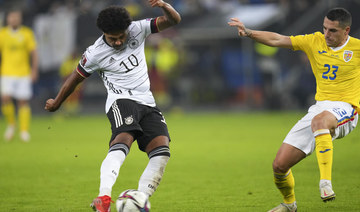 Germany beats Romania to continue winning start under Flick