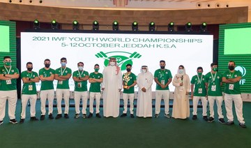 The Saudi team with the third place trophy at the 2021 IWF Youth World Cup. (SAWF)
