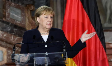 Merkel says EU must resolve Polish problem in talks, not courts