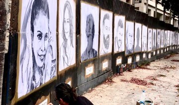 Beirut blast memorial wall covered in portraits of victims