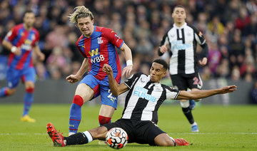 Crystal Palace's Conor Gallagher, left, and Newcastle's Isaac Hayden battles for the ball during the English Premier League match at Selhurst Park. (AP)