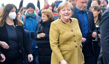 German acting Chancellor Angela Merkel arrives at the museum "Deutsches Auswandererhaus" (German Emigration Center) in Bremerhaven, Germany, November 4, 2021. (REUTERS)