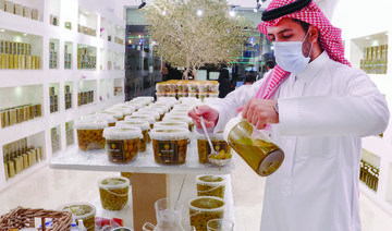 Saud Abdulamohsin Al-Juraid, the owner of  Al-Juraid farms, inherited the love of olive farming from  his father.  (AN photos by Huda Bashatah)