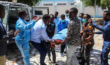 Family members carry the body of Abdiaziz Mohamud Guled, the director of government-owned Radio Mogadishu. (AFP)