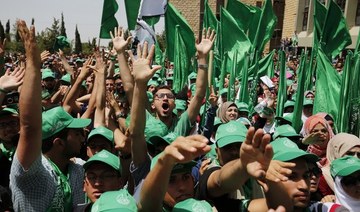 Palestinian students supporting the Hamas movement take part in an election campaign near the West Bank city of Ramallah. (AFP/File Photo)