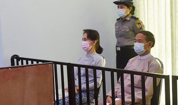  Detained civilian leader Aung San Suu Kyi (L) and detained president Win Myint (R) during their first court appearance in Naypyidaw. (AFP file photo)