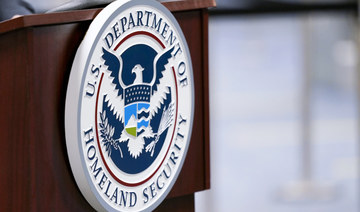 A U.S. Department of Homeland Security plaque is displayed a podium as international passengers arrive at Miami international Airport where they are screened by U.S. Customs and Border Protection, Nov. 20, 2020, in Miami. (AP)