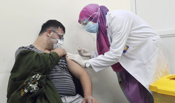 More than 22.8 million people fully vaccinated in Saudi Arabia. (AP)