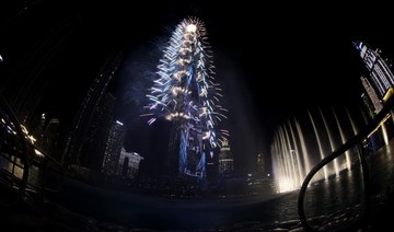 New Year's Eve fireworks lighting the landmark Burj Khalifa tower at midnight in Dubai. (AFP)
