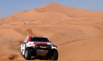 Toyota's South African driver Henk Lategan and co-driver Brett Cummings of South Africa compete during the Stage 5 of the Dakar 2022 around Riyadh in Saudi Arabia, on Jan. 6. (AFP)