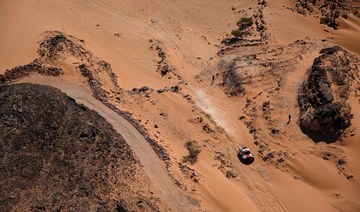 Toyota's driver Giniel De Villiers and his co-driver Dennis Murphy compete during the Stage 9 of the Dakar 2022 around Wadi Ad Dawasir in Saudi Arabia, on January 11, 2022. (AFP)