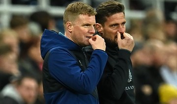Newcastle United's English head coach Eddie Howe (L) and his assistant Jason Tindall gesture on the touchline during the English FA Cup third round football match between Newcastle United and Cambridge United. (AFP)