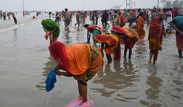 Indian doctors raise alarm as thousands throng Ganges for holy dip