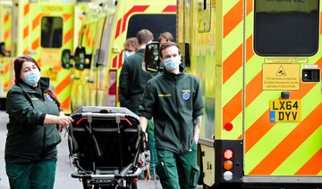 Health workers move equipment between ambulances outside of the Royal London Hospital, amid the coronavirus disease (COVID-19) pandemic in London, Britain, January 7, 2022. (REUTERS)