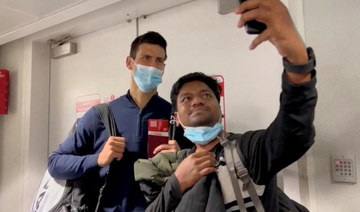Instead of playing center court in Australia, Djokovic poses for selfies in Dubai airport