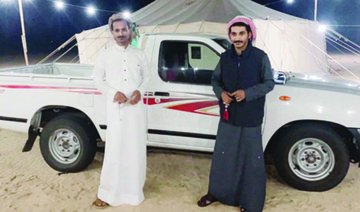 Mishal Al-Shlowi, from Taif, left, said that he is a big fan of the Dakar Rally. (Supplied)