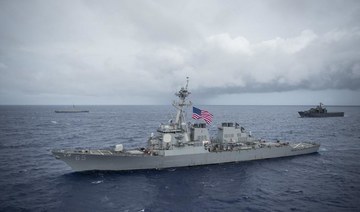 Beijing says it warned away US warship in South China Sea