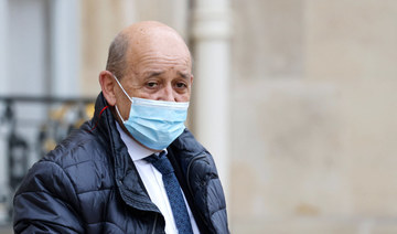 France's European and Foreign Affairs Minister Jean-Yves Le Drian leaves the weekly cabinet meeting at The Elysee Presidential Palace in Paris on January 26, 2022. (AFP)