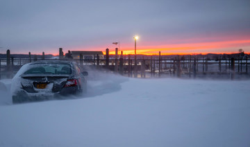 The sun sets following a major snowstorm on January 29, 2022 in Stony Brook, New York. (AFP)