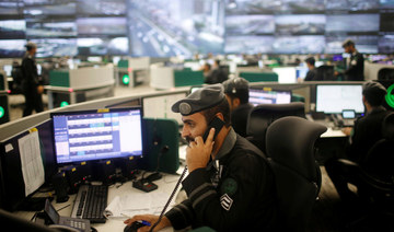 Saudi security guards monitor screens at the National Center for Security Operations in the holy city of Makkah, Saudi Arabia. (REUTERS file photo)