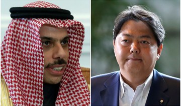 Japan’s foreign minister Hayashi Yoshimasa (R) help a phone call with Prince Faisal bin Farhan, Minister for Foreign Affairs of Saudi Arabia. (Reuters/File Photos)