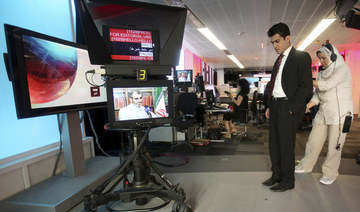 BBC Persian service presenter Fardad Farahzad gets ready to present the news, at the corporation's London headquarters. (AP/File Photo)