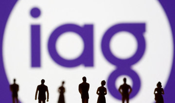 Small toy figures are seen in front of displayed IAG (Insurance Australia Group) logo in this illustration taken on Nov. 8, 2021. (REUTERS/File Photo)