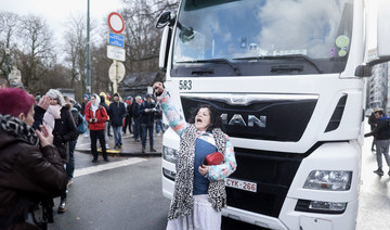 A protester shouts slogans during an unauthorised demonstration of participants of the so-called "Freedom Convoy" (Convoi de la Liberte) in the center of Bruxelles on February 14, 2022 to protest against coronavirus disease. (AFP)
