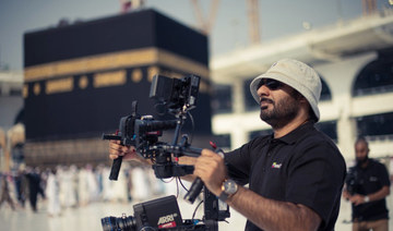 Filmmaker Abrar Hussain films in the Mataf area of the Grand Mosque in Makkah, Saudi Arabia, in October 2017. (Photo courtesy: Red Face Films)