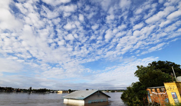 A submerged shed is seen on the bank of the overflowing Clarence River in Grafton, some 130 kms from the New South Wales town Lismore on, March 1, 2022. (AFP)