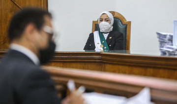 Egyptian female judge Radwa Helmi Ahmad sits on her first court hearing at the State Council in the capital Cairo, on March 5, 2022. (AFP)