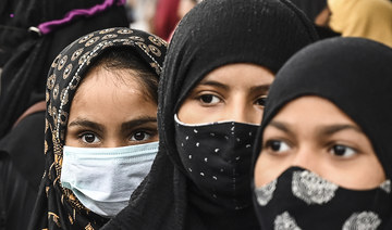 Muslim women take part in a protest against the recent hijab ban in few educational institutes of Karnataka state, in Kolkata. (AFP)