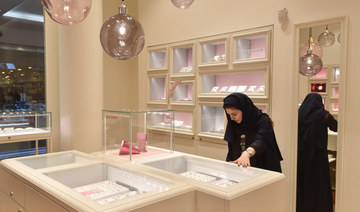  Saudi Rodina Maamoun, who employed 19 young women almost entirely replacing the men, sells jewellery at a retail store in Riyadh's Hayat mall on February 19, 2020. (AFP)