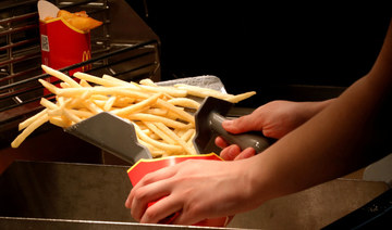 An employee cooks French fries at a McDonald's restaurant in Moscow, Russia April 24, 2018. (REUTERS)