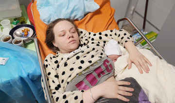 Mariana Vishegirskaya lies in a hospital bed after giving birth to her daughter Veronika, in Mariupol, Ukraine, Friday, March 11, 2022. (AP)