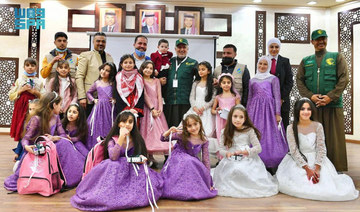 KSrelief chief Dr. Abdullah Al-Rabeeah pose for a group photo with Syrian orphans in Amman. (SPA)