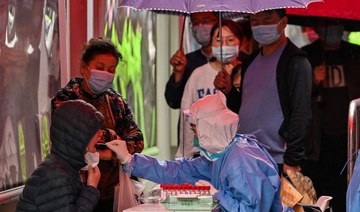 Shanghai pushes ahead with mass COVID-19 tests as new cases spike