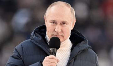 Russian President Vladimir Putin delivers a speech during a concert marking the eighth anniversary of Russia's annexation of Crimea at Luzhniki Stadium in Moscow. (Reuters)