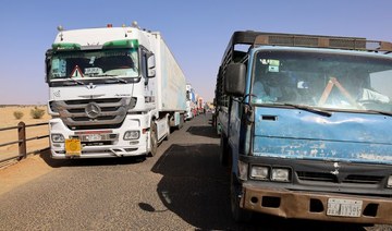 An image showing hundreds of truck drivers stuck in a blockade of a major export route out of Sudan into Egypt. (Reuters/File Photo)
