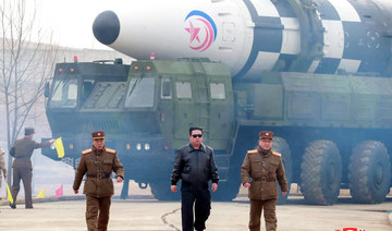 North Korean leader Kim Jong Un (C) walking near a new type inter-continental ballistic missile before its test launch in an undisclosed location in North Korea. (AFP file photo)