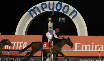 Country Grammer ridden by Frankie Dettori wins the Dubai World Cup. (Reuters)