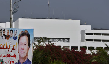 A portrait of Pakistan's Prime Minister Imran Khan hangs near the National Assembly building in Islamabad, Pakistan, Monday, March 28, 2022. (AP)