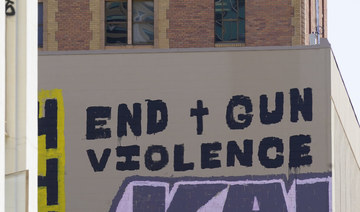 A sign calling for the end of gun violence is displayed on April 6, 2022, near the scene of a recent mass shooting in Sacramento, California.(AP Photo/Rich Pedroncelli) 