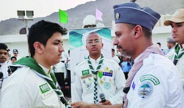 Saudi boy scouts have enthusiastically resumed their responsibilities to serve worshippers at the Grand Mosque during Ramadan this year following the coronavirus pandemic. (Supplied)