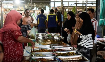Thai Muslims buy food items at a market during the fasting month of Ramadan in Narathiwat, southern Thailand. (AFP/File Photo)