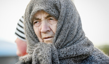 A Ukrainian refugee arrives at the Siret border crossing between Romania and Ukraine on April 18, 2022. (AFP)