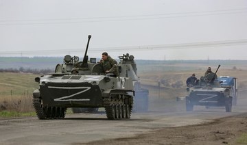 Russian military vehicles move on a highway in an area controlled by Russian-backed separatist forces near Mariupol, Ukraine. (AP)