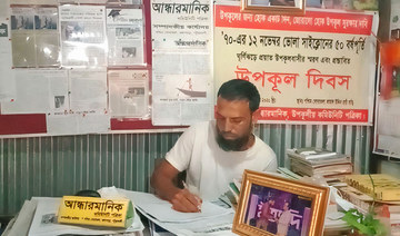 Handwritten newspaper brings world to remote Bangladeshi south