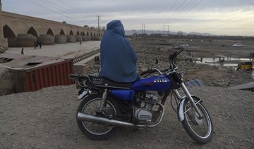 Afghan women defend right to drive as Taliban curb licenses